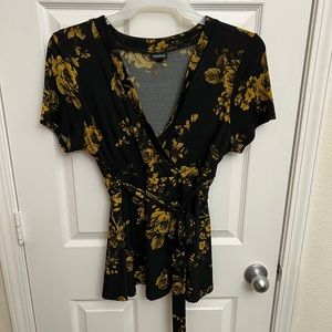 Torrid blouse, wrap around. Black/gold floral print